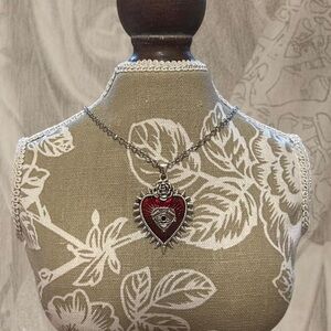 Silver chain necklace with rose thorn pendant